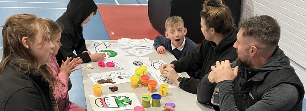 Children taking part in colouring activities during a SEND Stay and Play session at Life Leisure Houldsworth Village